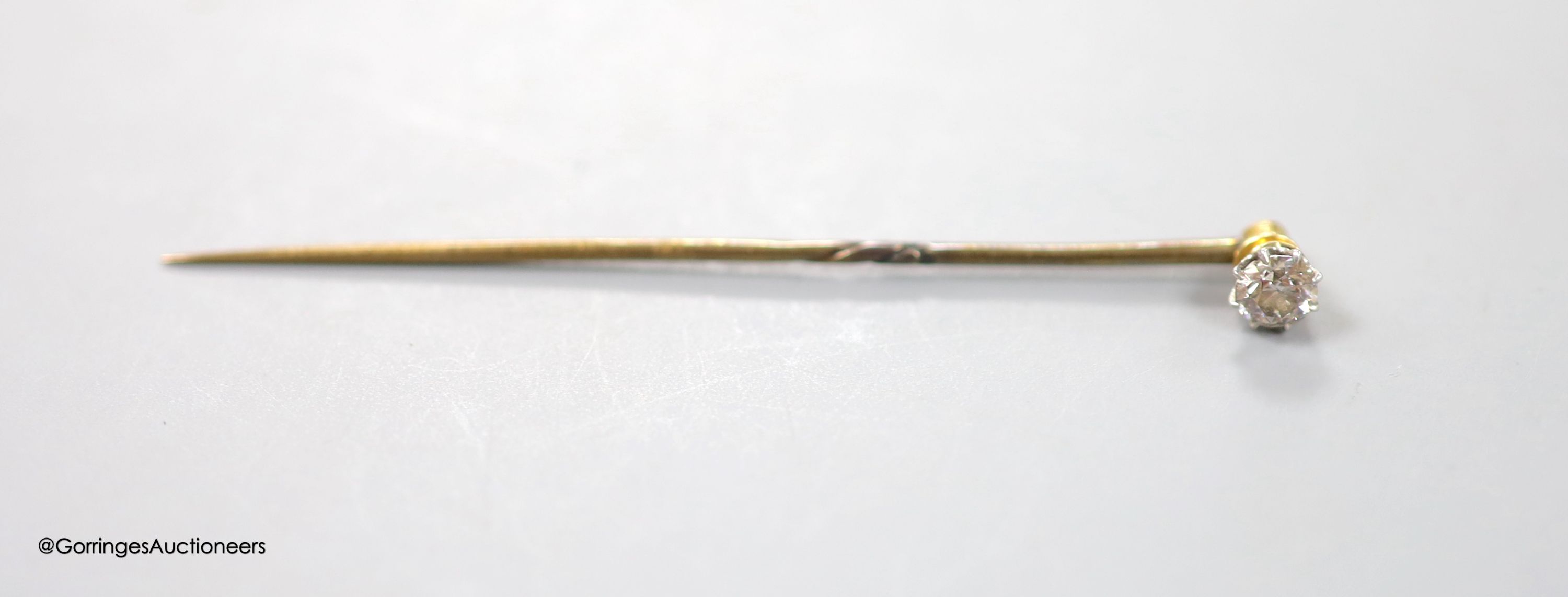 A solitaire diamond set stick pin, 63mm, gross 1.3 grams